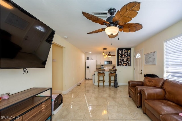 living room with ceiling fan