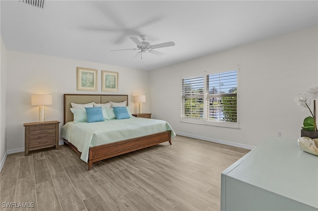 bedroom featuring ceiling fan and light hardwood / wood-style flooring