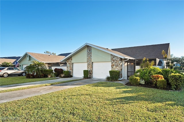 ranch-style home featuring a garage and a front lawn