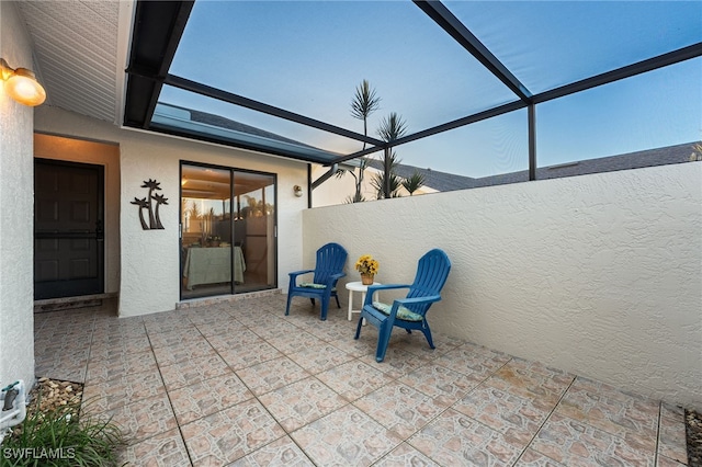 view of patio / terrace with a lanai