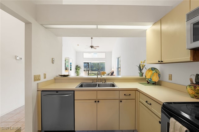 kitchen with ceiling fan, sink, stainless steel appliances, kitchen peninsula, and light tile patterned flooring