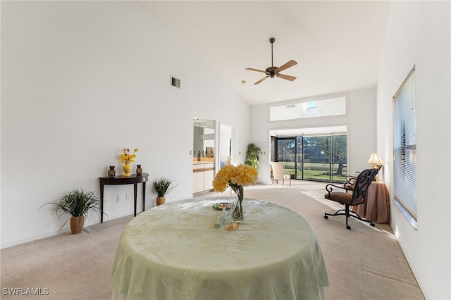 interior space with ceiling fan and high vaulted ceiling