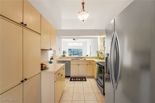 kitchen featuring stainless steel appliances, ceiling fan, sink, light tile patterned floors, and decorative light fixtures