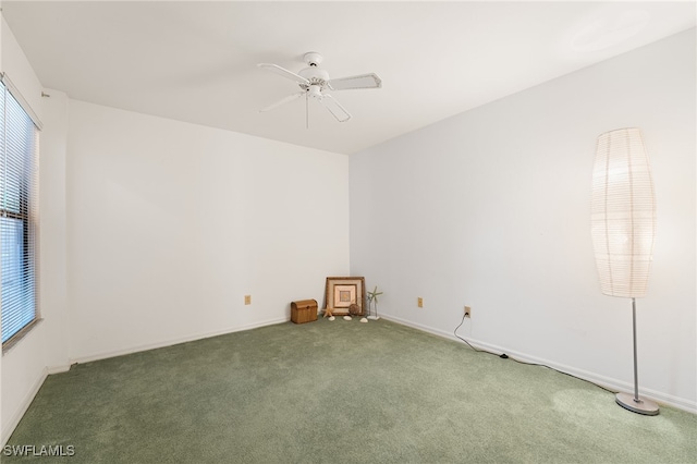 unfurnished room featuring ceiling fan and carpet floors