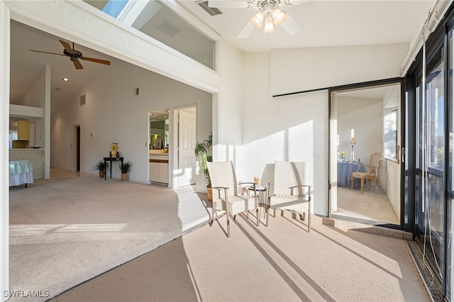 sunroom / solarium featuring ceiling fan and vaulted ceiling