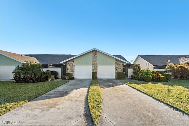 ranch-style house with a garage and a front lawn