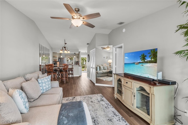 living room featuring dark hardwood / wood-style flooring, ceiling fan, and lofted ceiling