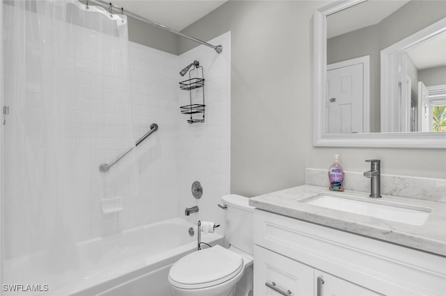 full bathroom with vanity, tiled shower / bath combo, and toilet