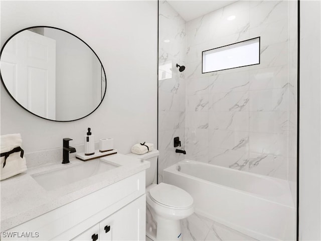 full bathroom featuring toilet, vanity, and tiled shower / bath