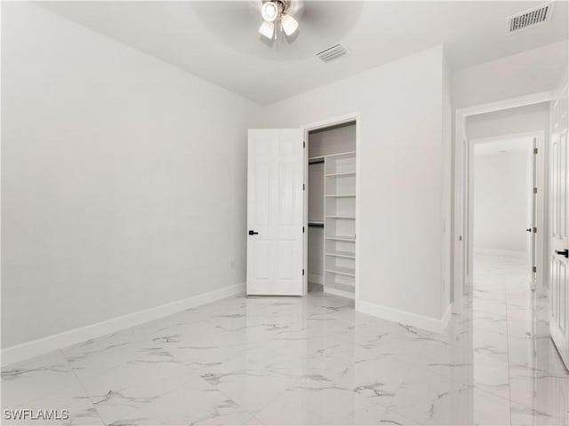 unfurnished bedroom with a closet and ceiling fan