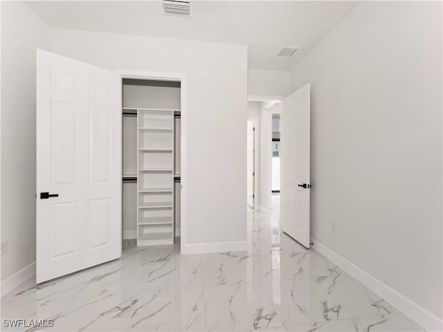 unfurnished bedroom with a closet