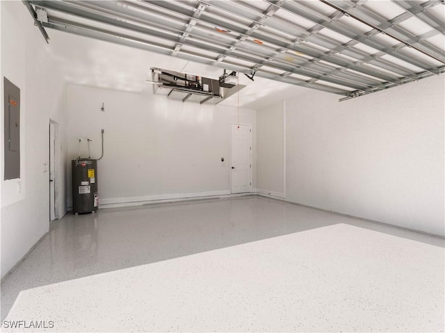 garage with a garage door opener, electric panel, and water heater