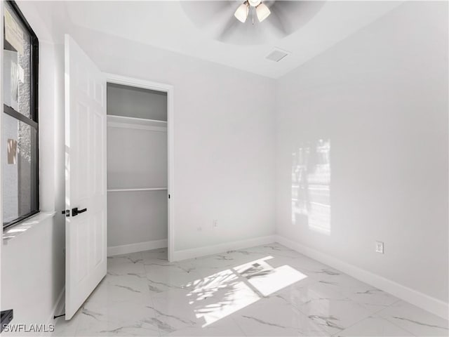 unfurnished bedroom featuring a closet and ceiling fan