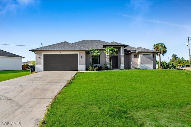 view of front facade with a garage and a front lawn