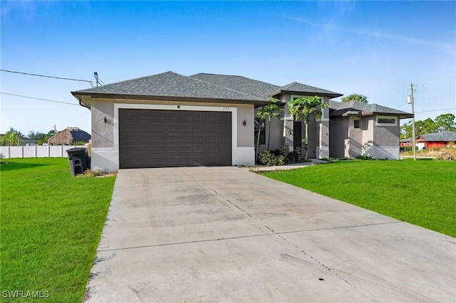 view of front of house with a garage and a front lawn