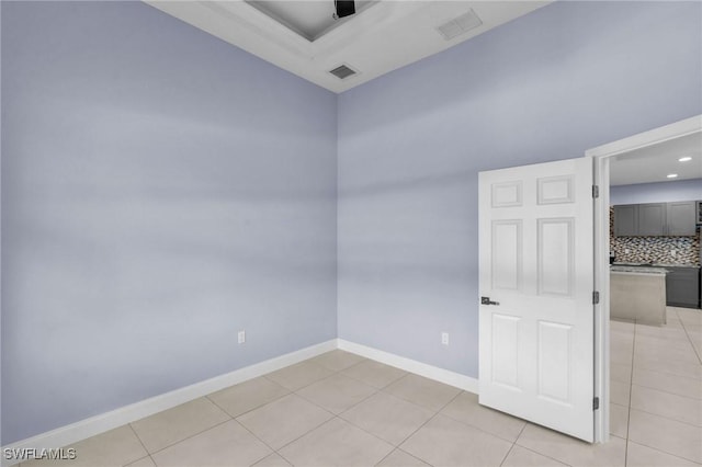 empty room with light tile patterned floors