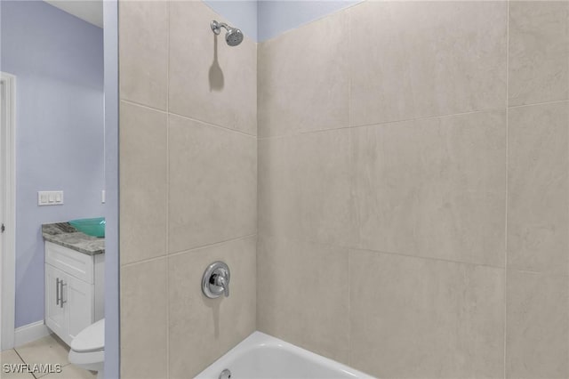 full bathroom with toilet, tile patterned floors, vanity, and tiled shower / bath combo