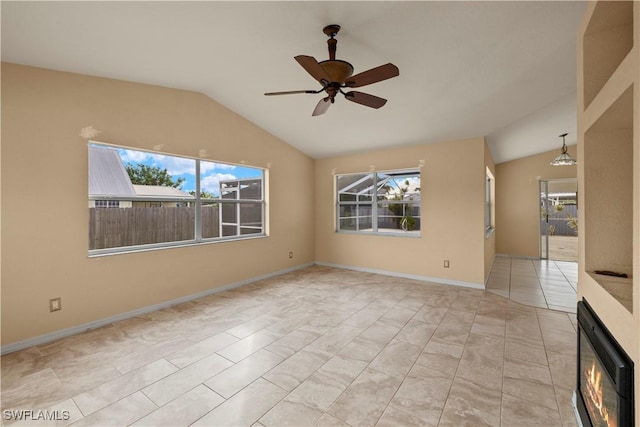 tiled spare room featuring lofted ceiling and ceiling fan