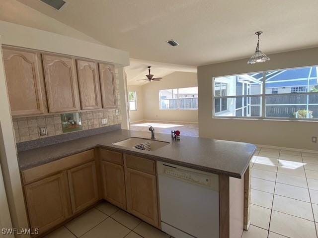 kitchen featuring decorative backsplash, dishwasher, sink, and kitchen peninsula