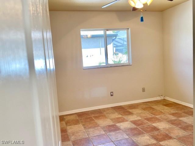 spare room featuring ceiling fan