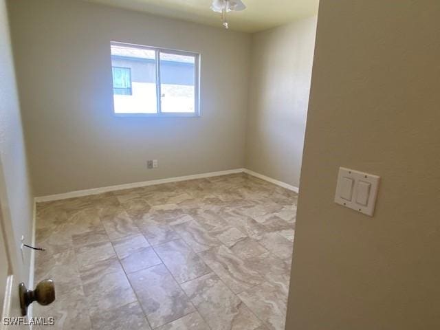 empty room featuring ceiling fan