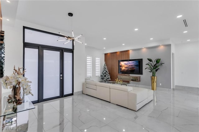 living room featuring an inviting chandelier