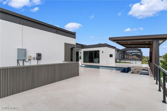 view of patio / terrace with glass enclosure