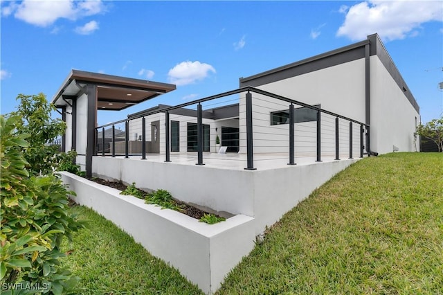 view of side of home featuring a yard