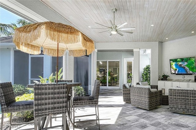 view of patio featuring ceiling fan