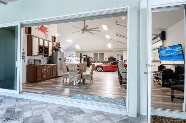 dining space featuring light hardwood / wood-style flooring and ceiling fan