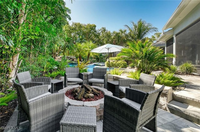 view of patio / terrace with a fire pit