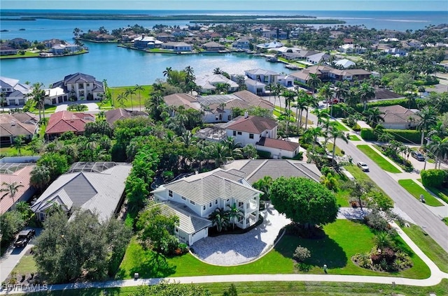 birds eye view of property featuring a water view