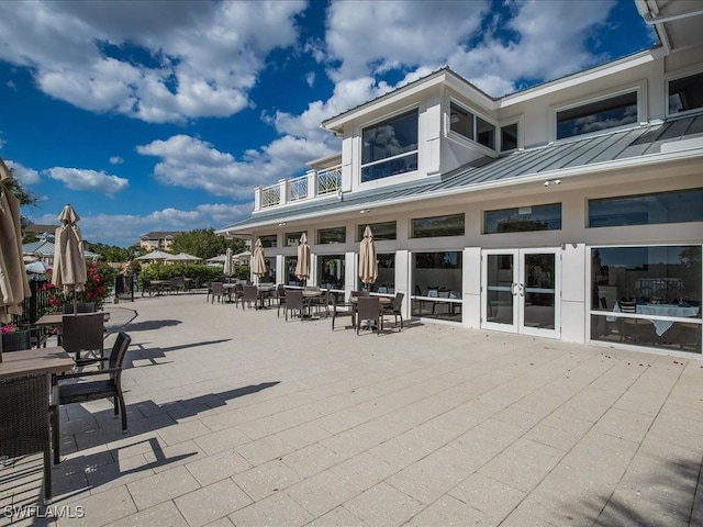 view of patio / terrace featuring a balcony and french doors