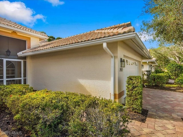 view of property exterior with a garage