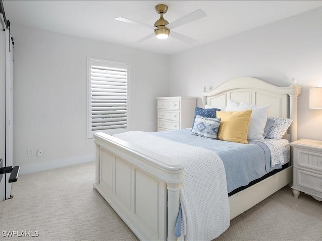 bedroom featuring ceiling fan and light carpet