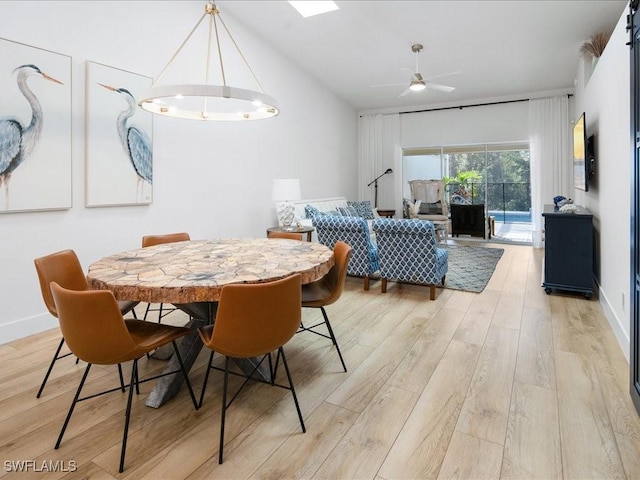 dining area with ceiling fan and light hardwood / wood-style flooring