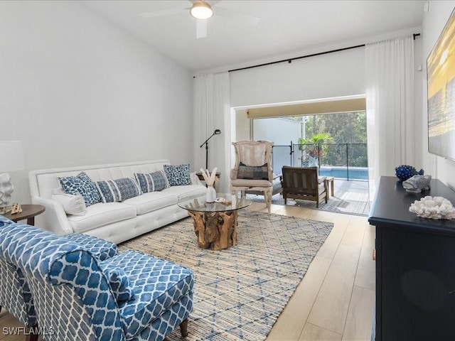 living room with hardwood / wood-style floors and ceiling fan