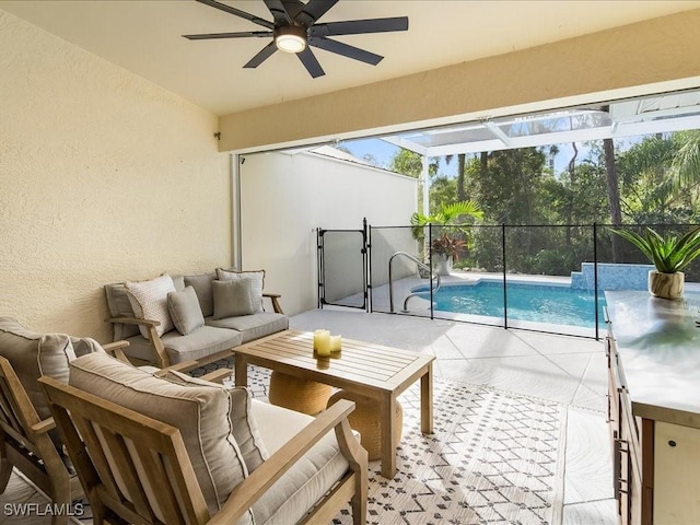 view of patio / terrace featuring outdoor lounge area, ceiling fan, and a lanai