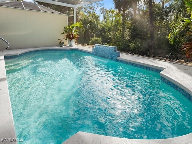 view of pool with a lanai