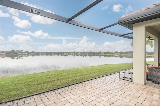 view of patio with a water view