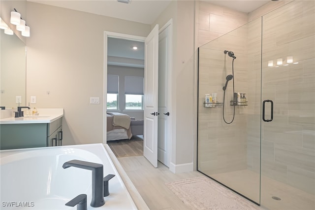 bathroom with vanity and a shower with shower door