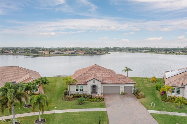 exterior space with a water view and a garage