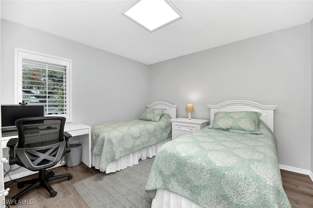 bedroom featuring hardwood / wood-style floors