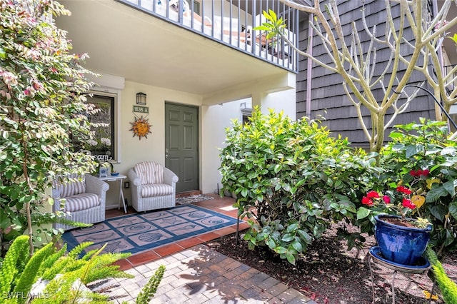 view of patio / terrace featuring a balcony and a wall mounted AC