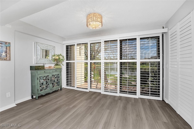 unfurnished dining area with hardwood / wood-style floors