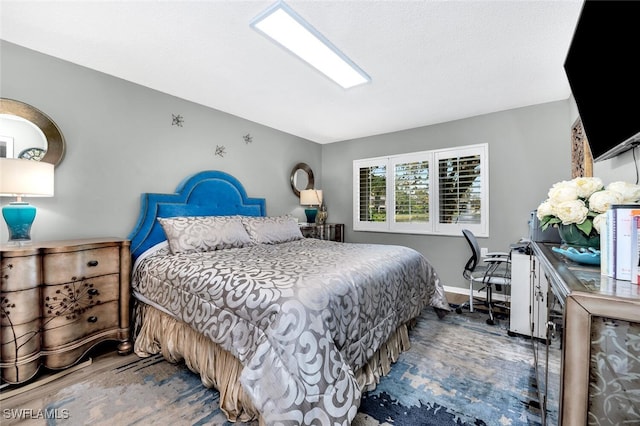 bedroom featuring wood-type flooring