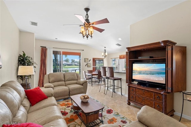 living room with ceiling fan, light tile patterned flooring, and vaulted ceiling