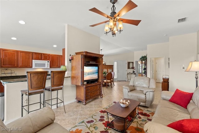 tiled living room featuring ceiling fan