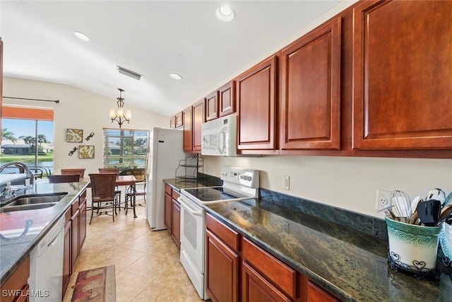 kitchen featuring sink, hanging light fixtures, an inviting chandelier, vaulted ceiling, and white appliances