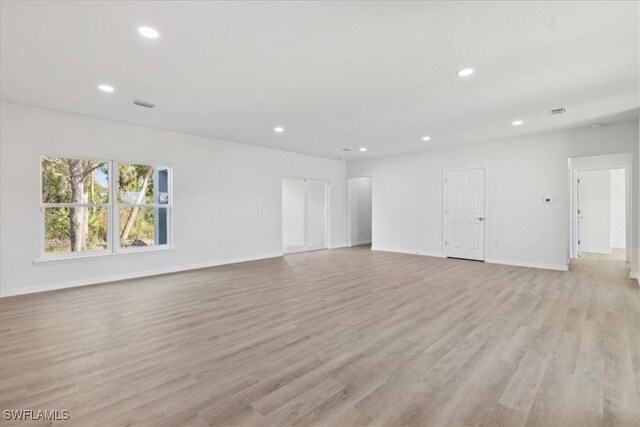 empty room with light wood-type flooring